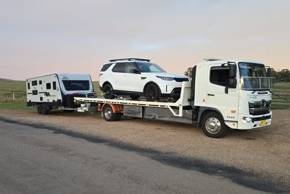 Rv is Being Towed by a Tow Truck — NCM Towing Newcastle In Broadmeadow, NSW