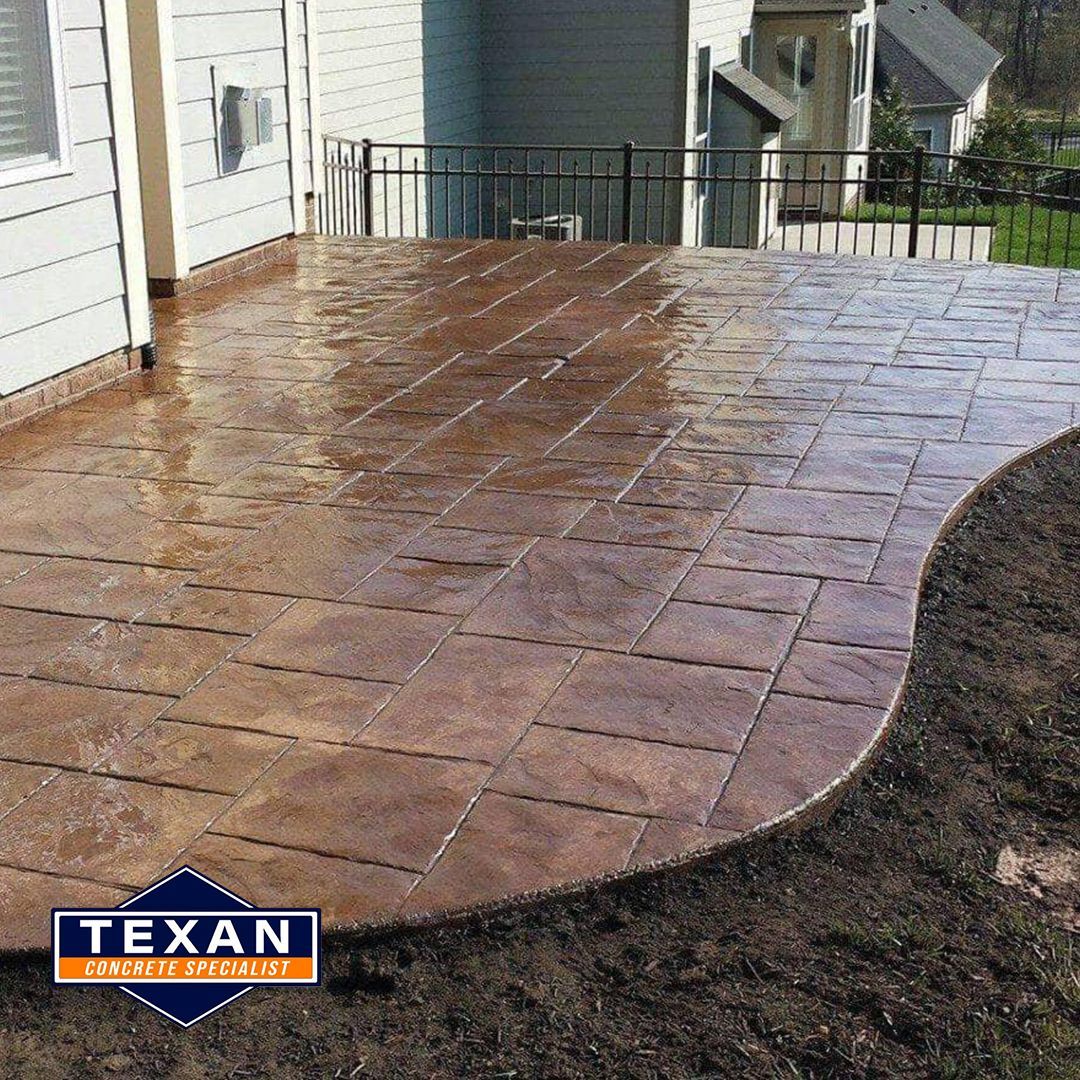 A patio with a texan logo on it