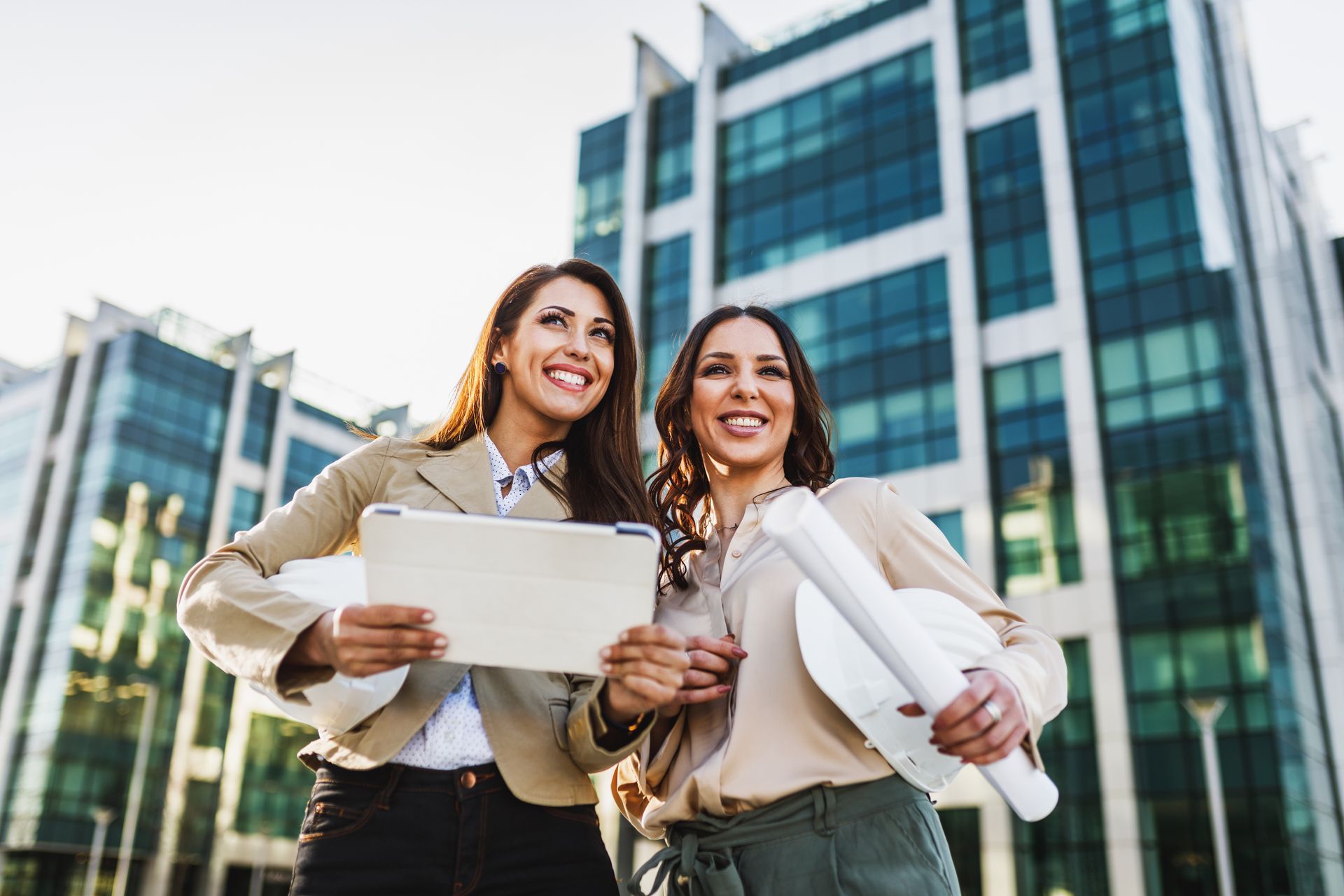 2 Female Realtors standing outside of the Building