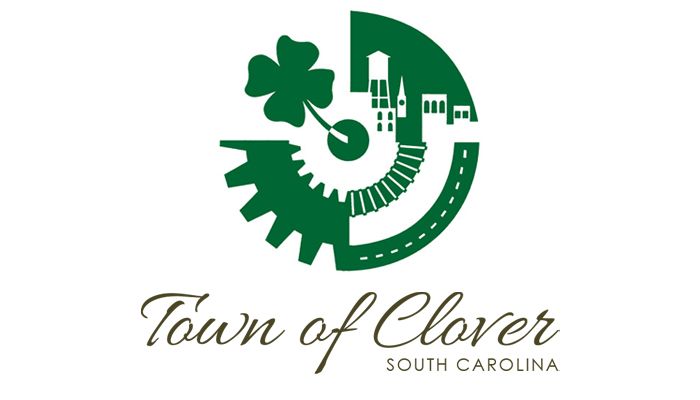Town of Clover, South Carolina logo with green shamrock, gear, and buildings