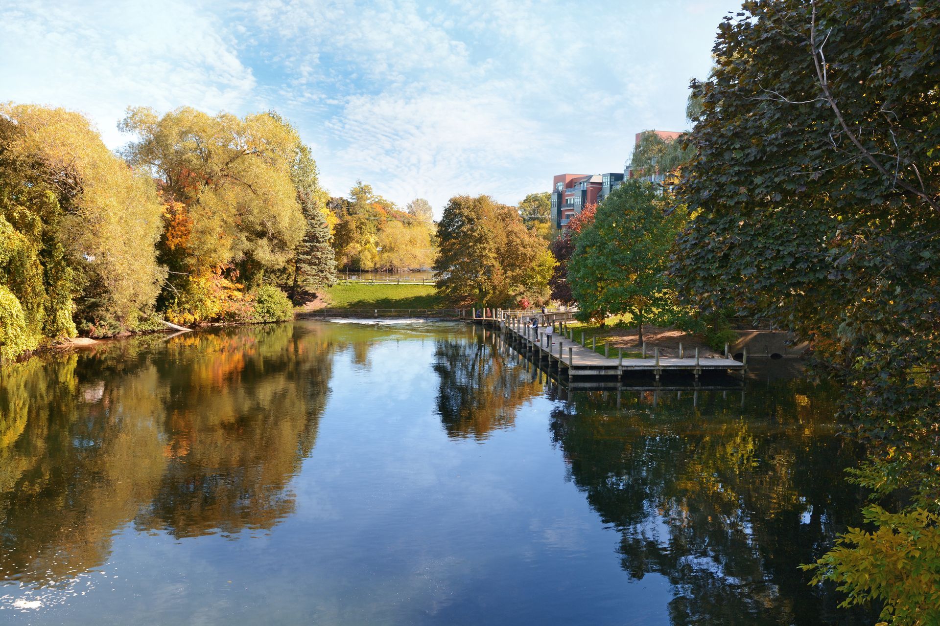 A Large Body of Water Surrounded by Trees and A Dock - Rochester Hills, MI - J & B Doors