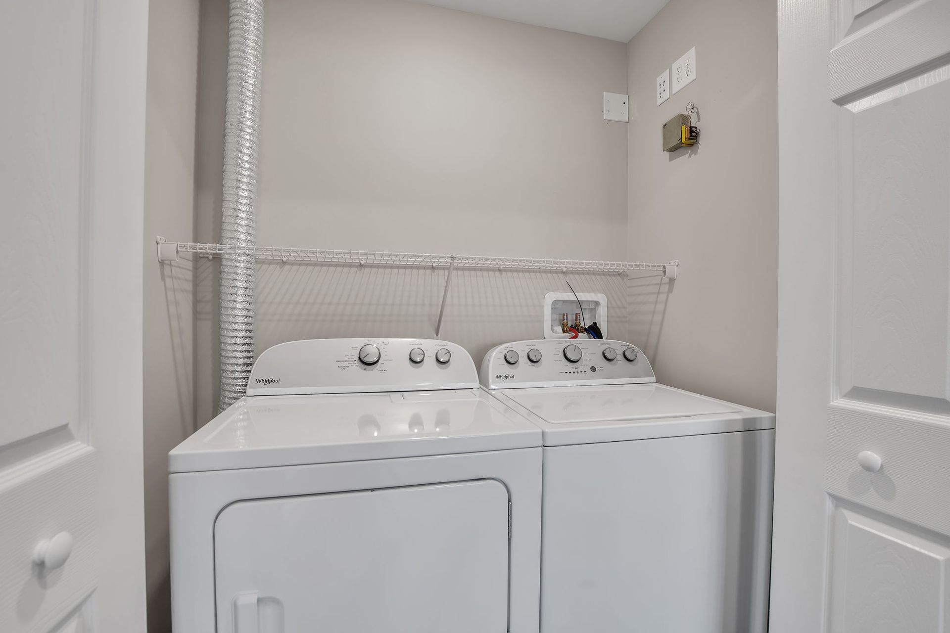 Laundry room area with washer and dryer appliances