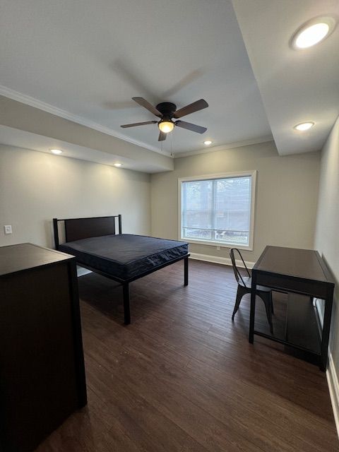 Bright apartment bedroom with large window and natural light