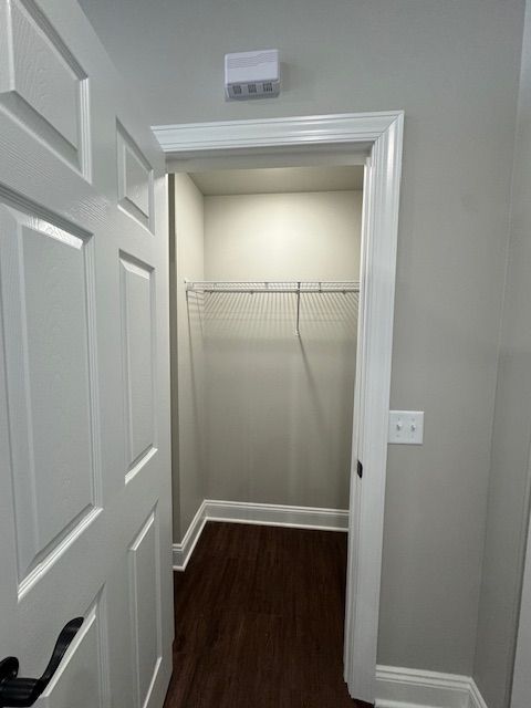 Apartment storage closet with hanging rack