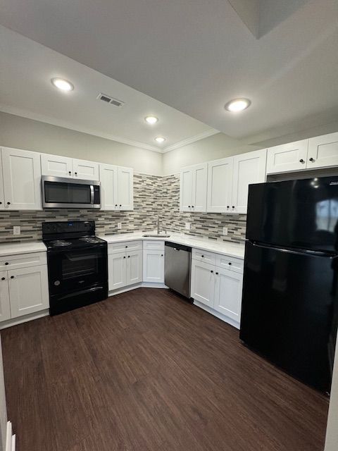 Kitchen interior designed with modern cabinetry and surfaces