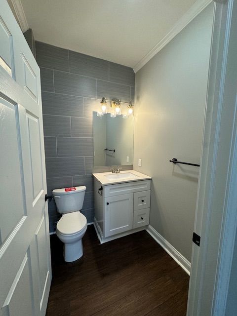Bathroom interior showcasing modern sink and mirror hardware