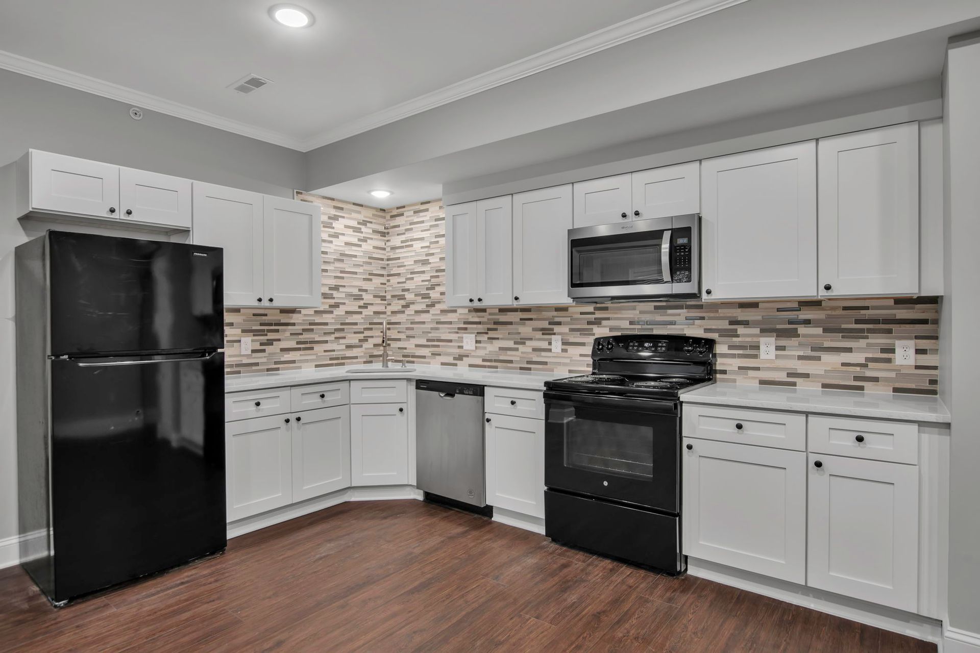 Cooking area designed with sleek cabinets and organized layout