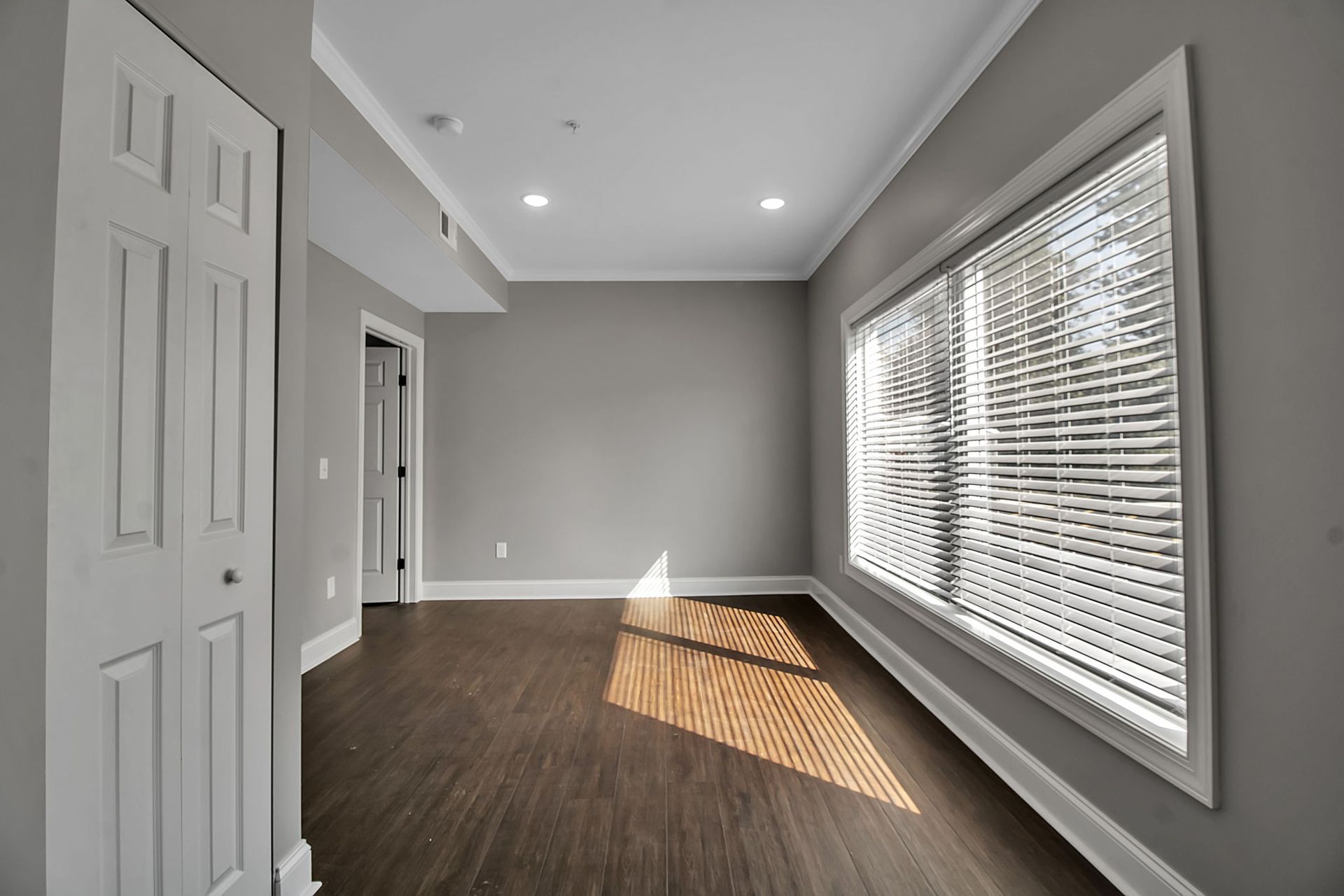 Apartment sitting area with contemporary floor finish and neutral palette