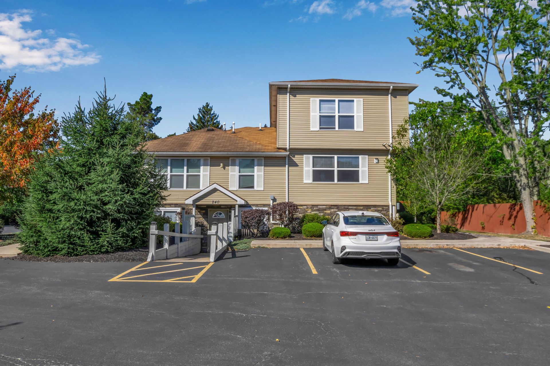 Parking lot adjacent to townhouse-style apartments