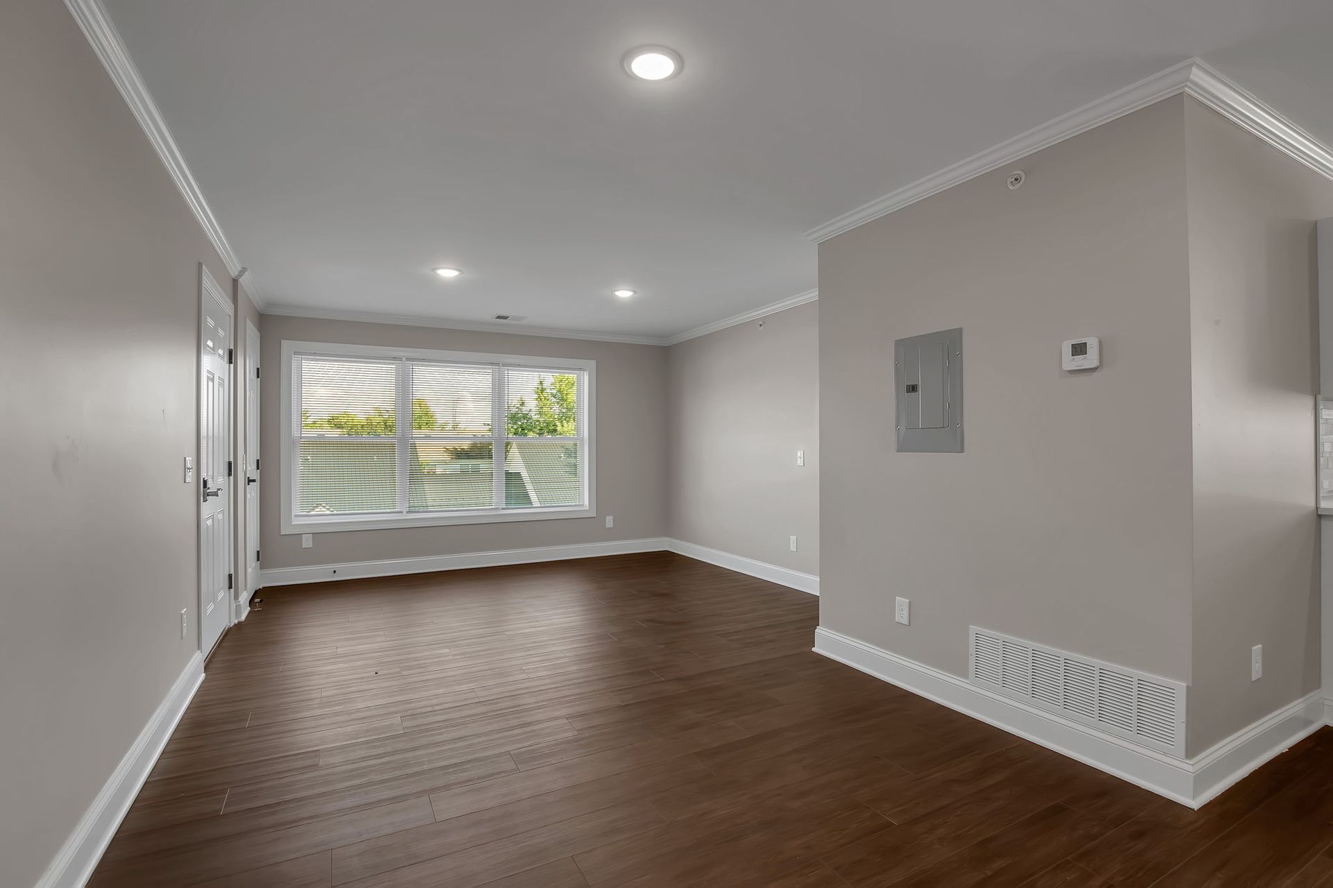 Apartment lounge interior with wide open layout and neutral tones