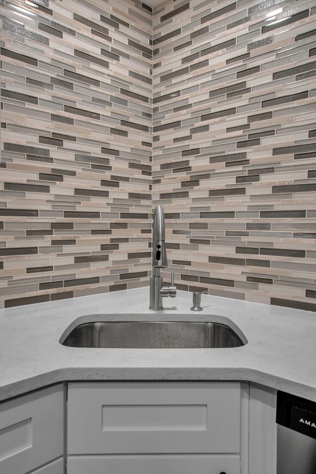 Bathroom space featuring sleek tile finish and fixtures