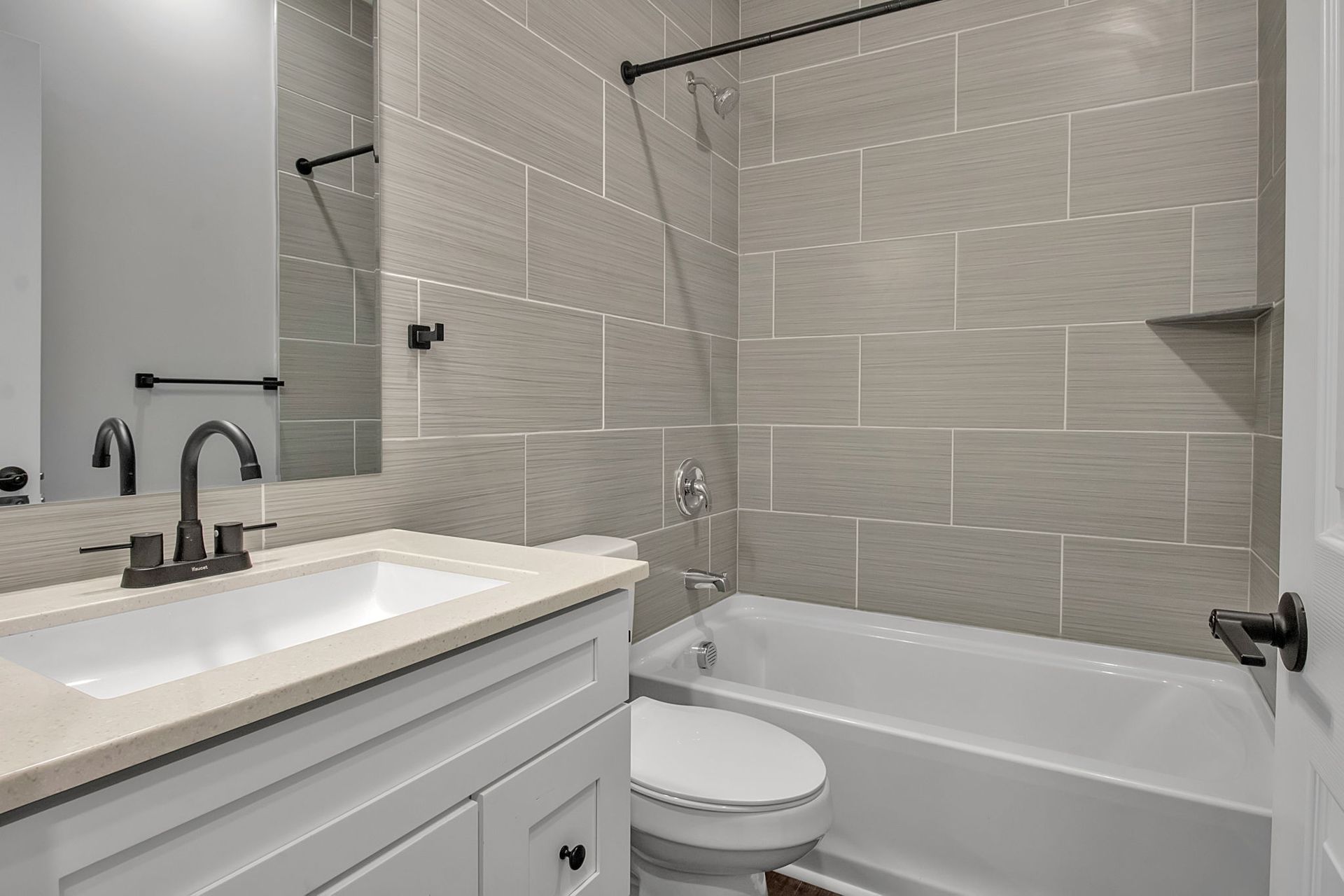 Wash area with modern plumbing elements and mirror