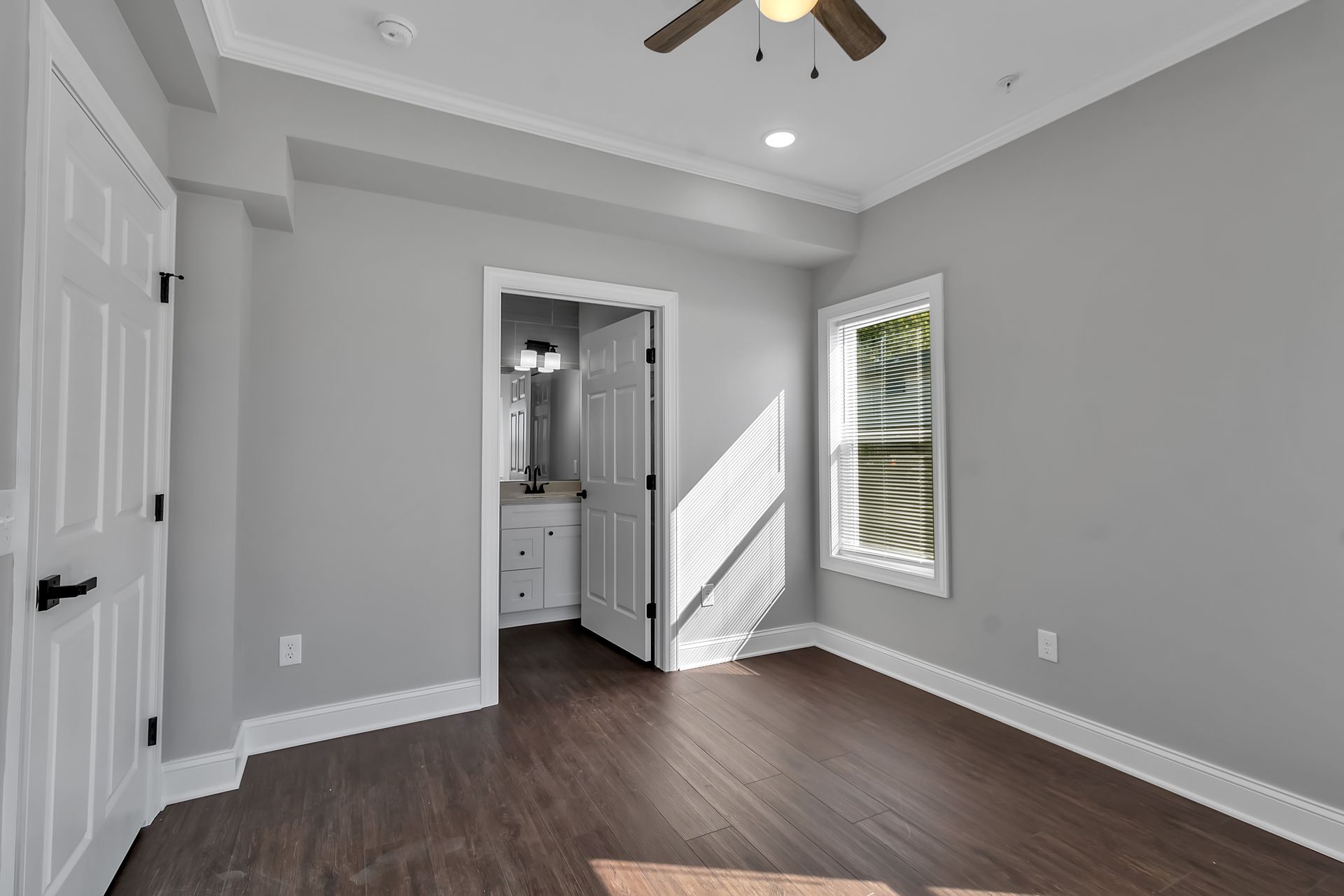 Sleeping room with smooth flooring and subtle wall trim