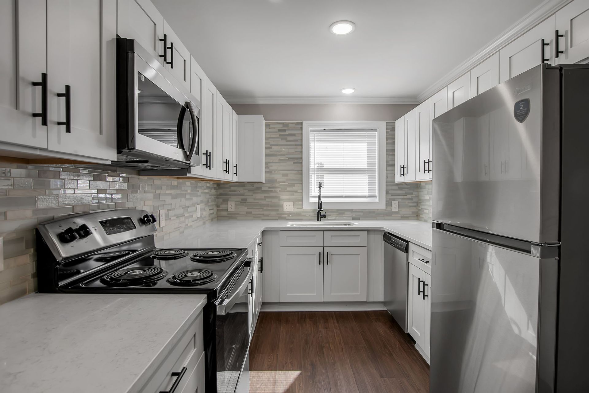 Apartment kitchen with sleek cabinetry and preparation space