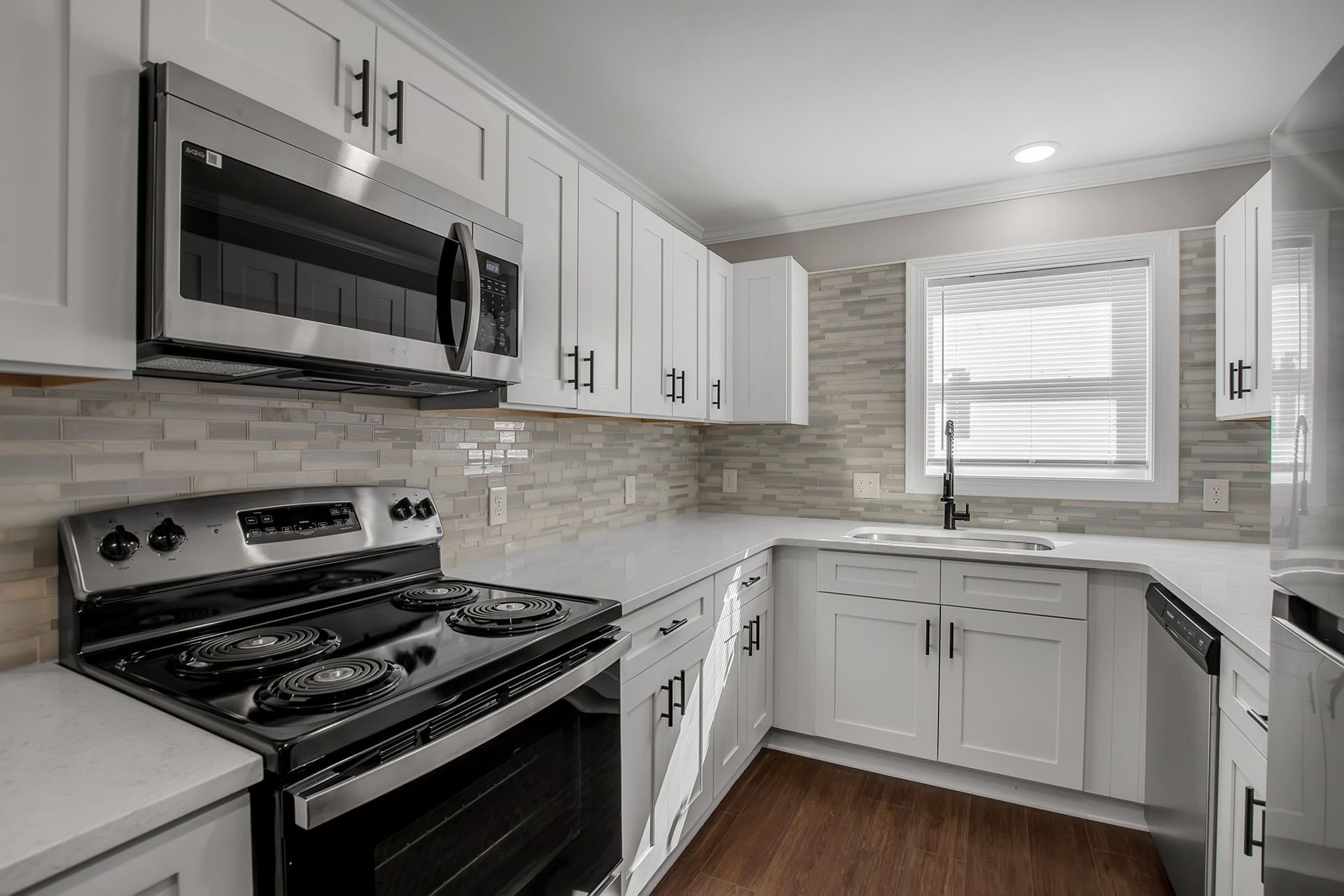 Kitchen interior with organized cabinet storage and surfaces
