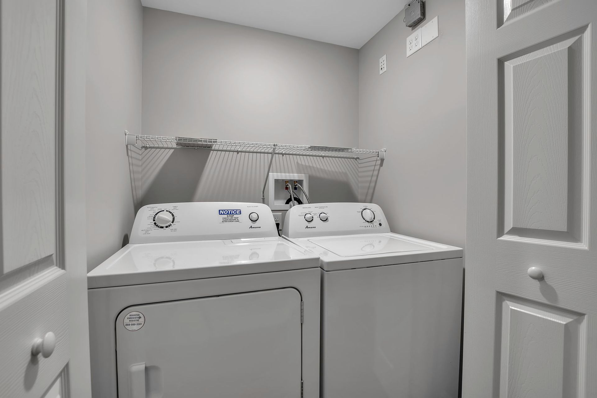 In-unit dryer appliance installed within apartment laundry area