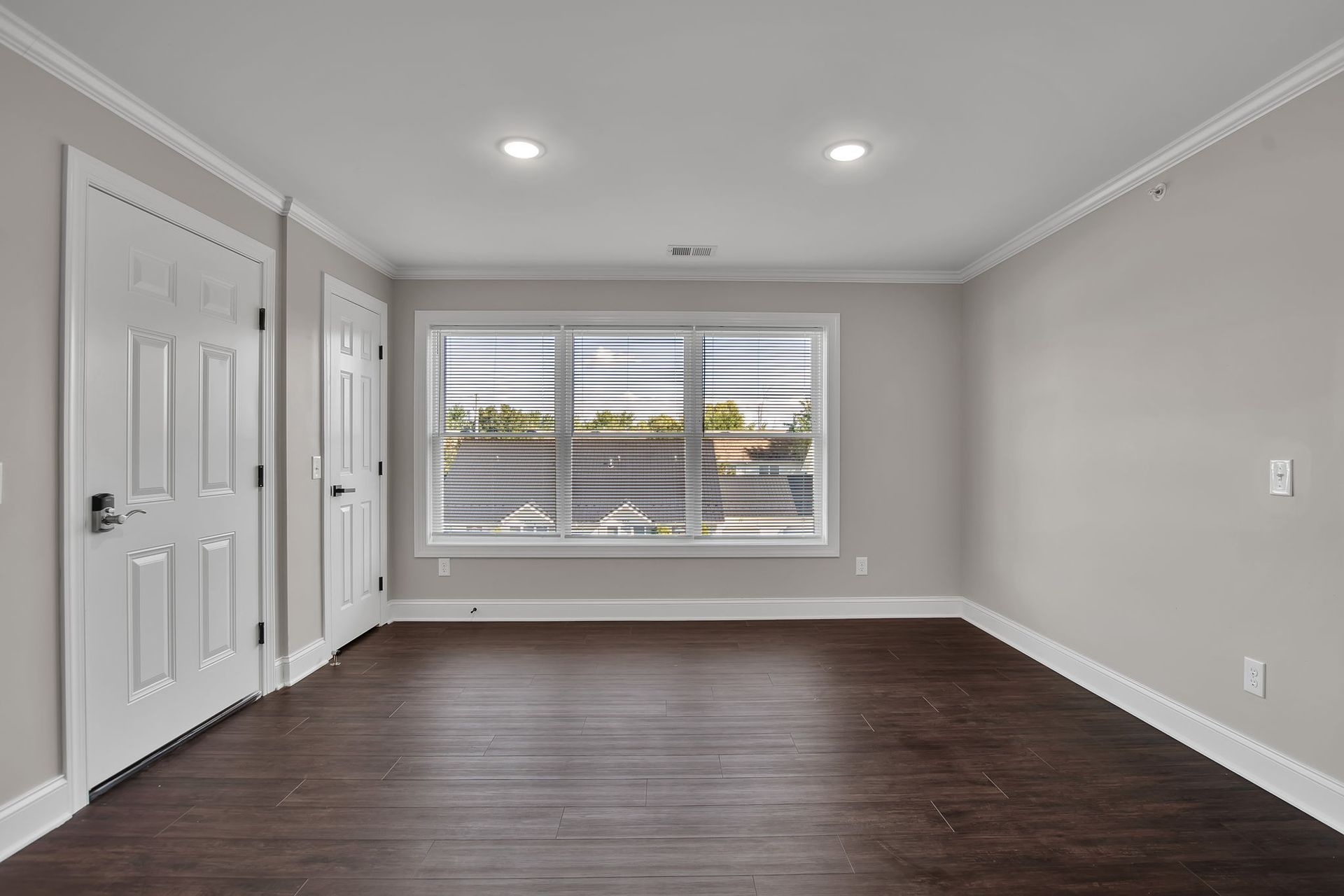 Bedroom interior with wide floor area and subtle trim details