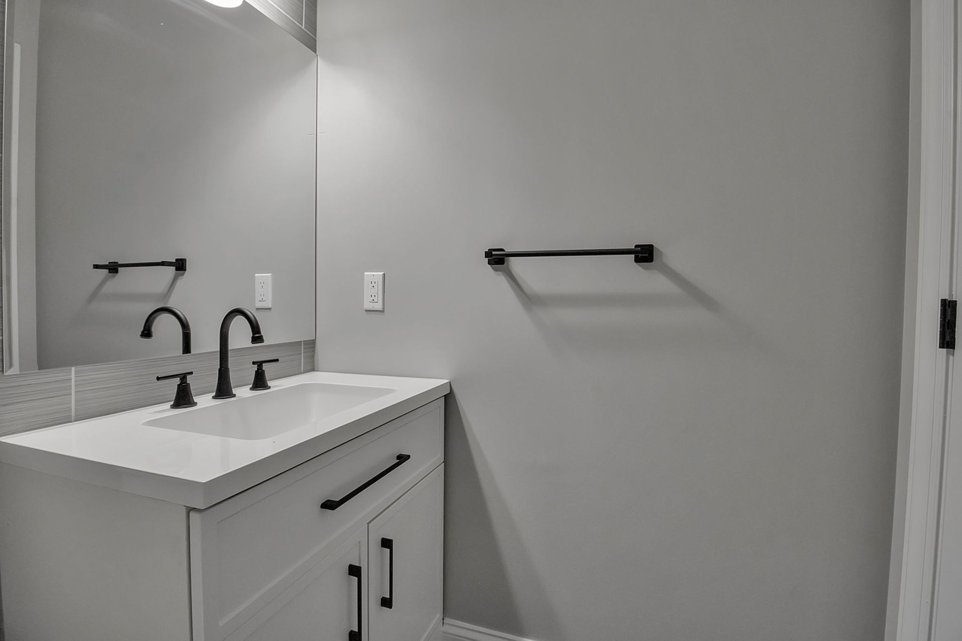 Wash area with modern tile and plumbing hardware