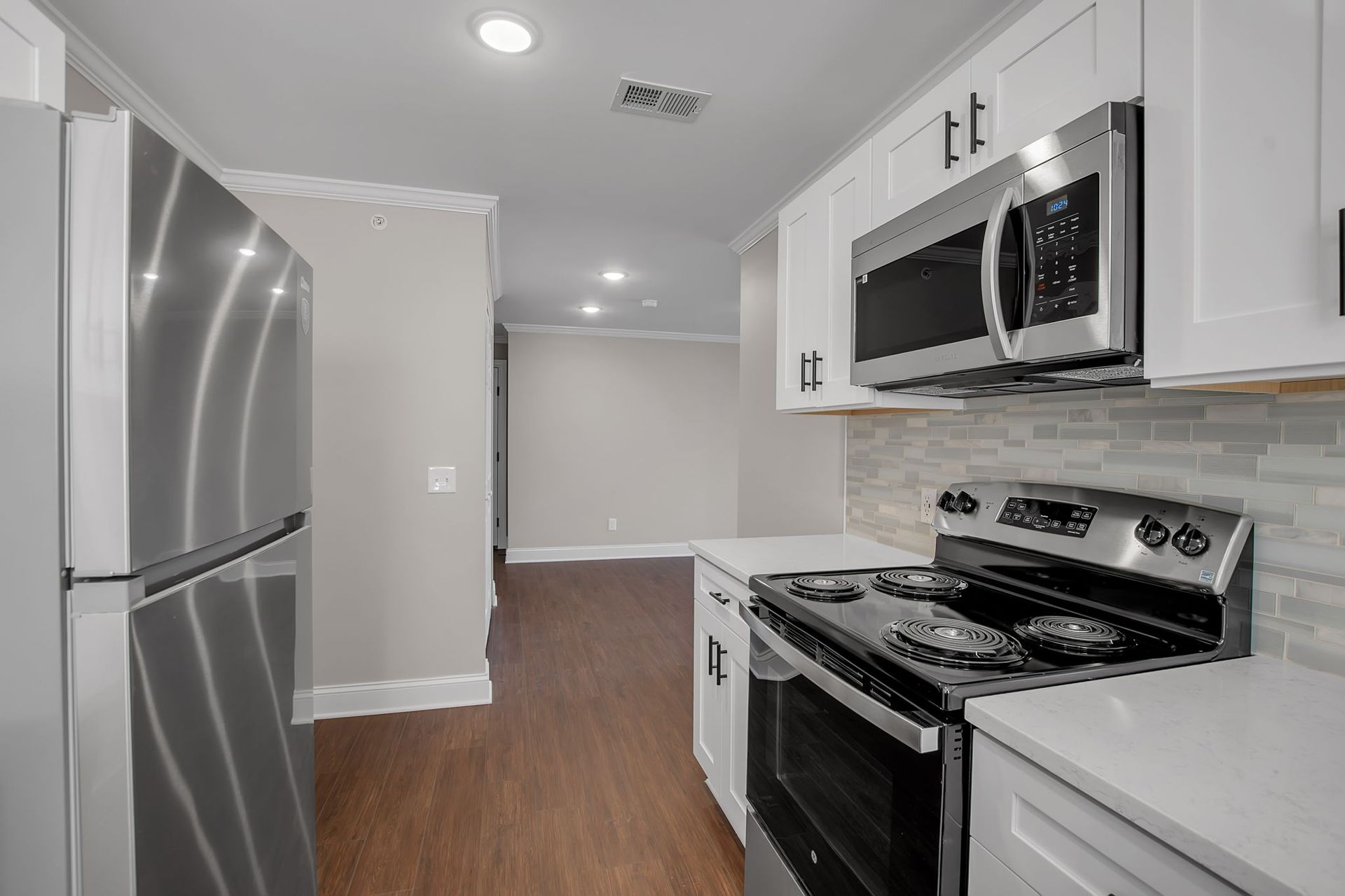 Kitchen interior with updated cabinetry and preparation surfaces