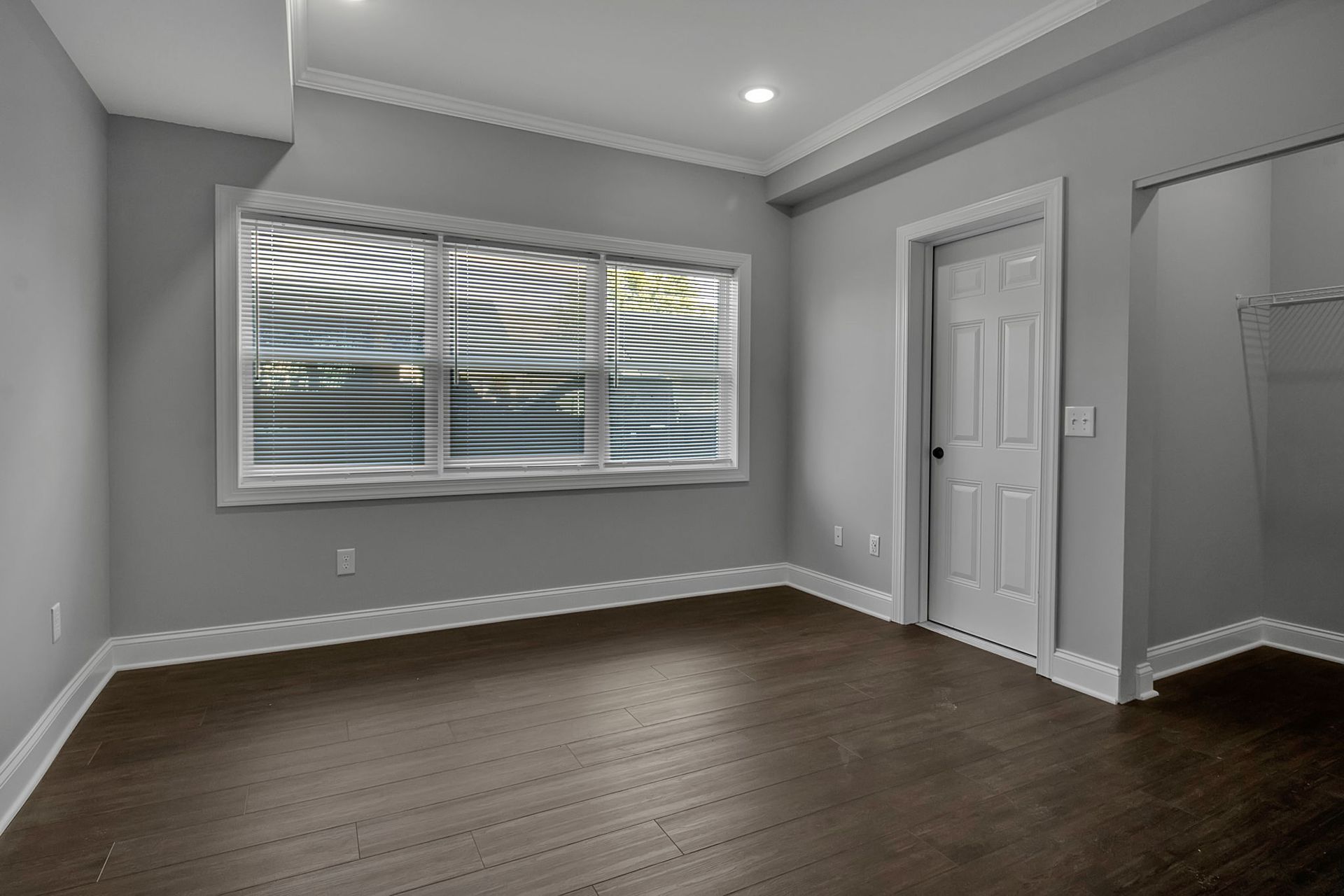 Large apartment bedroom with double closet doors