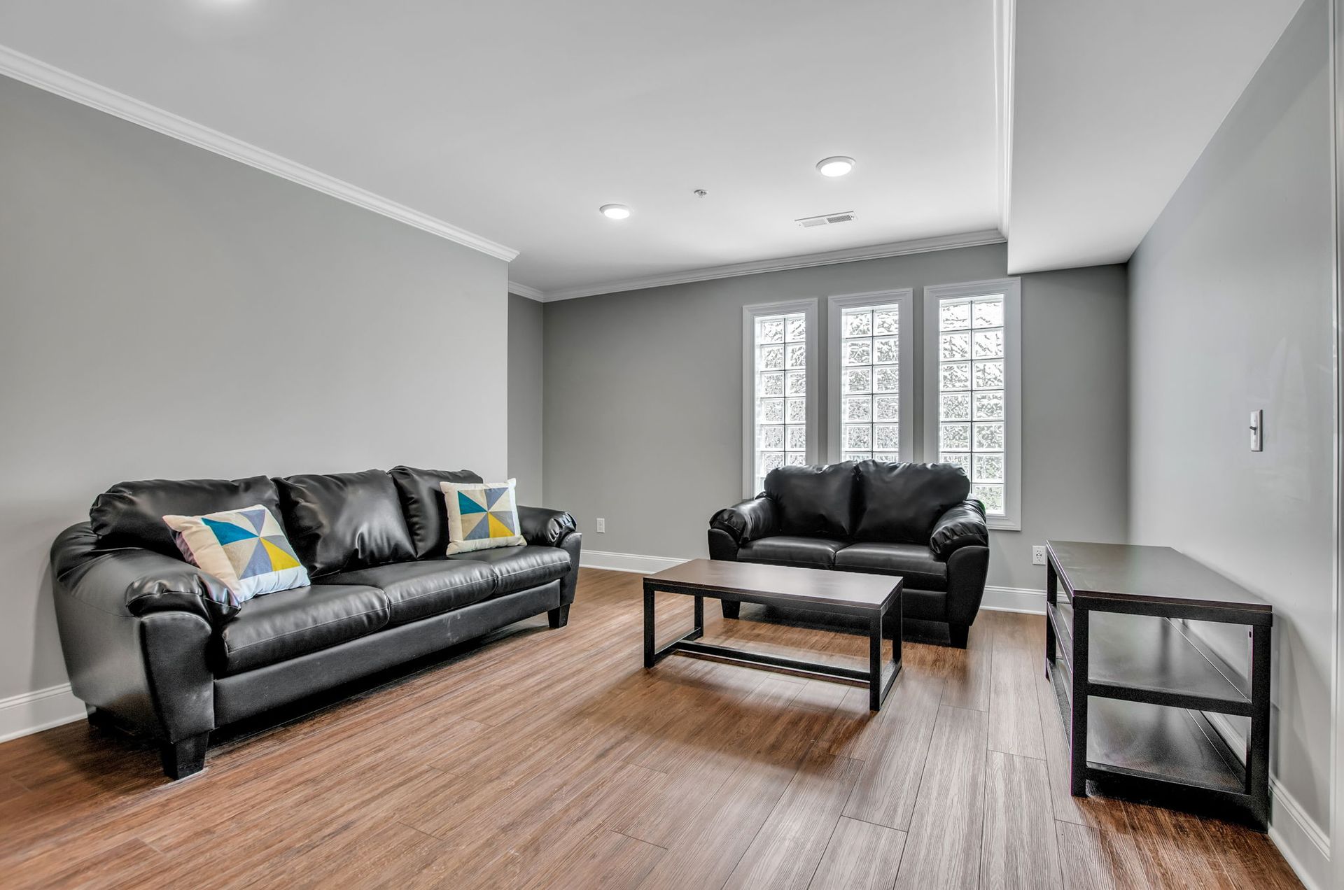 A living room with two couches and a coffee table.