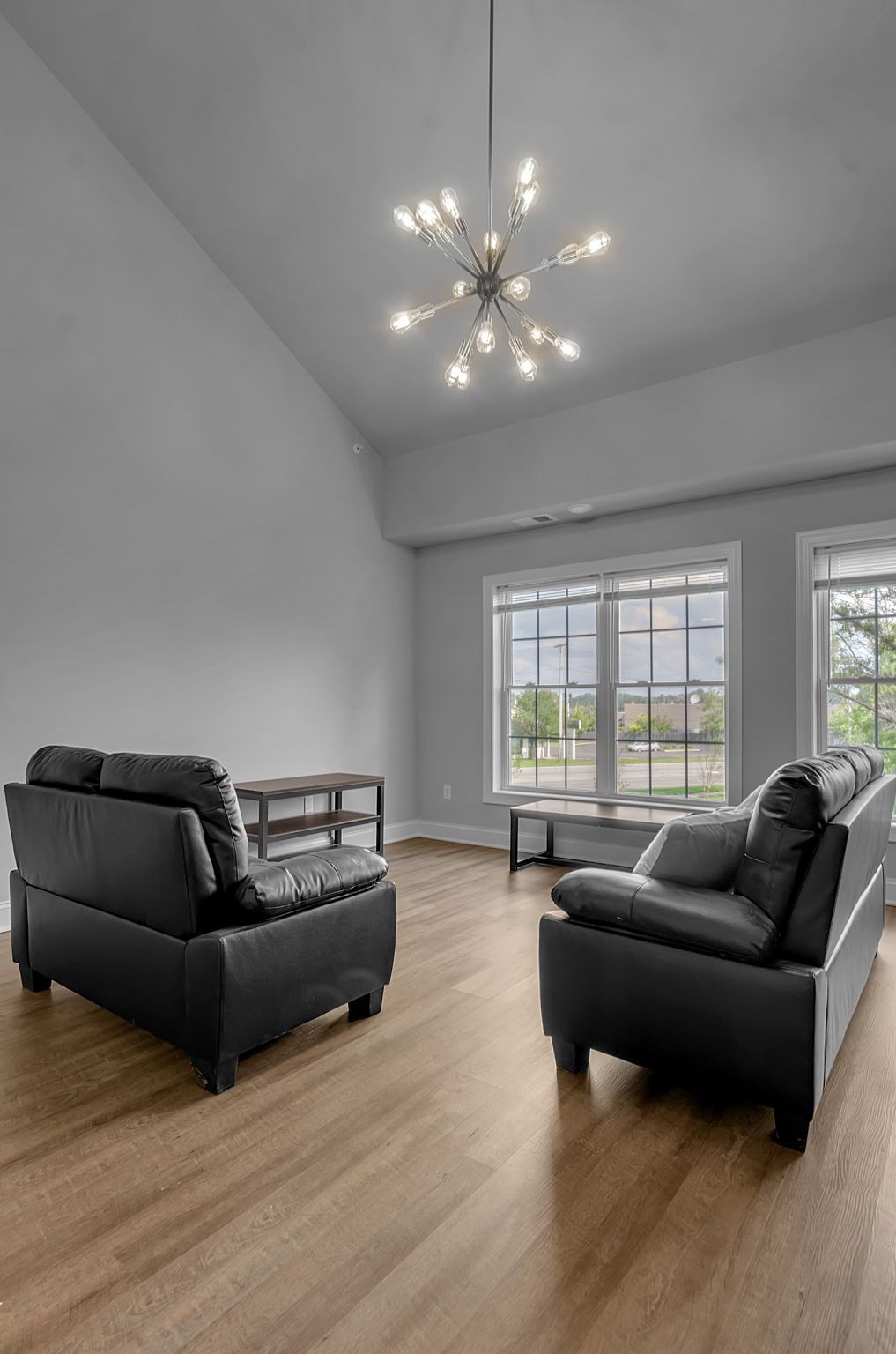 There are two chairs and a couch in the living room.