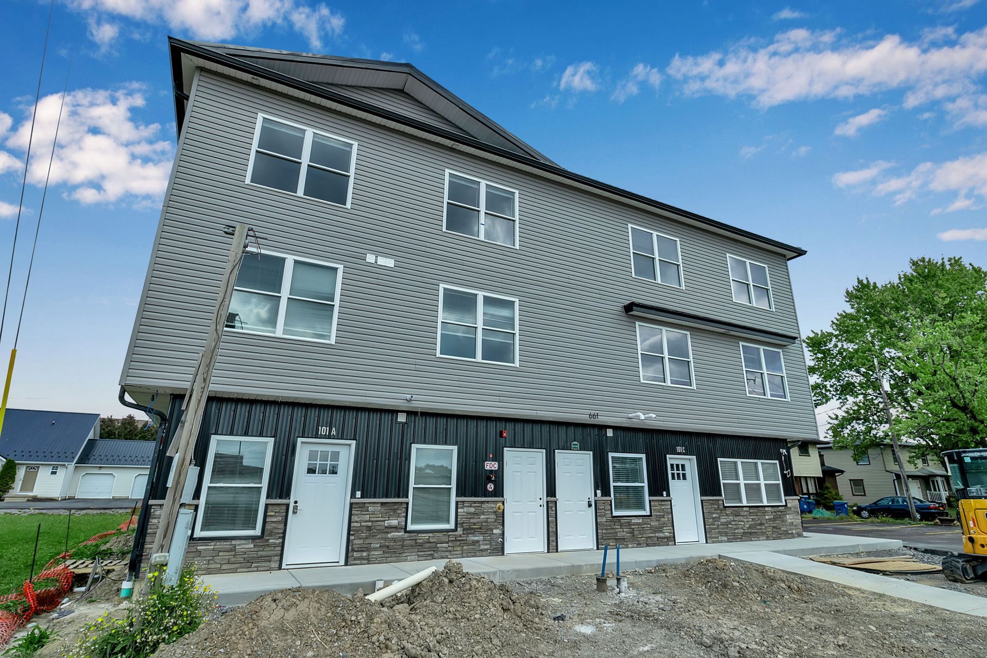 Modern apartment complex with landscaped entrance in Amherst NY