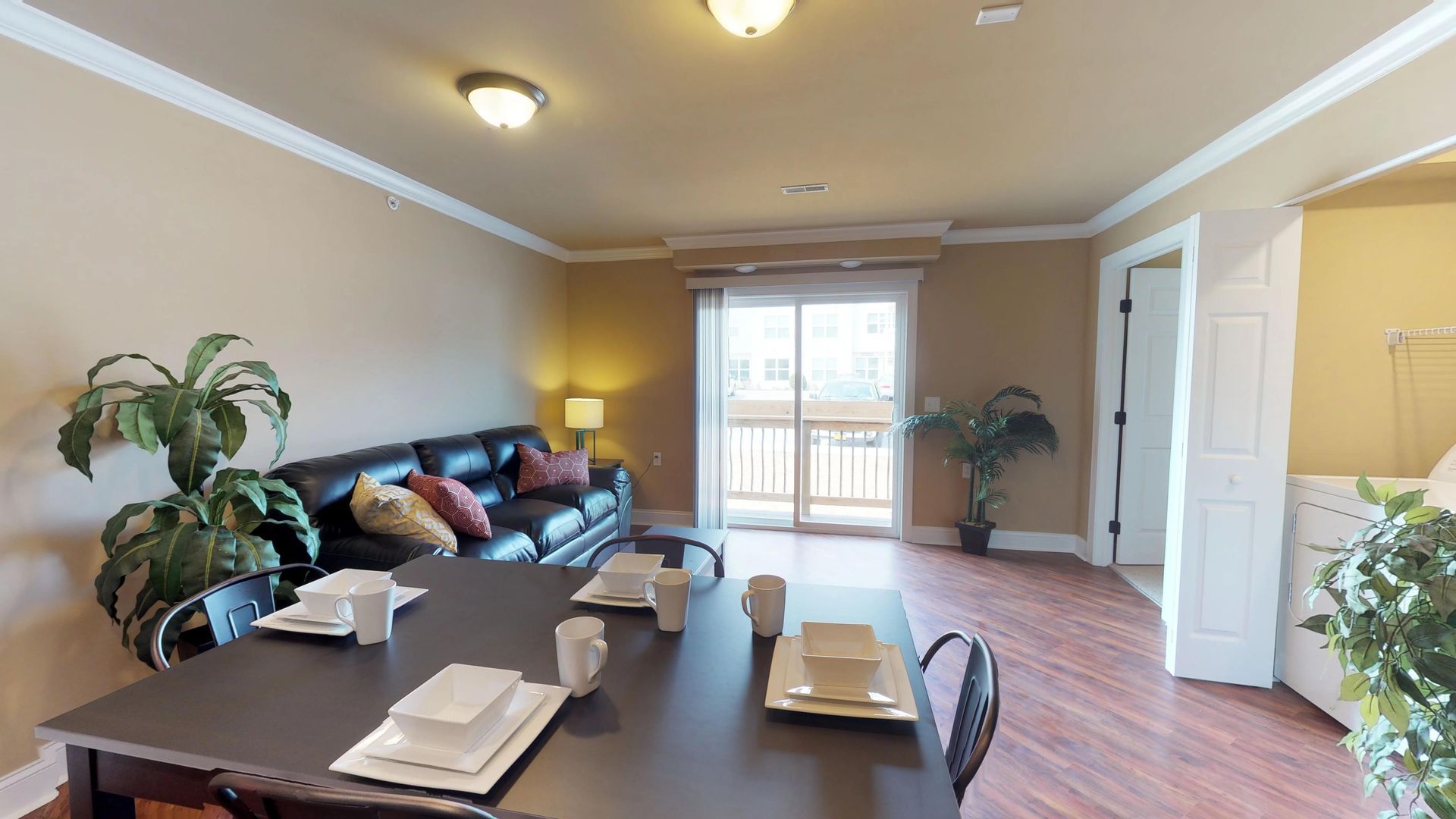 A living room with a table and chairs and a couch