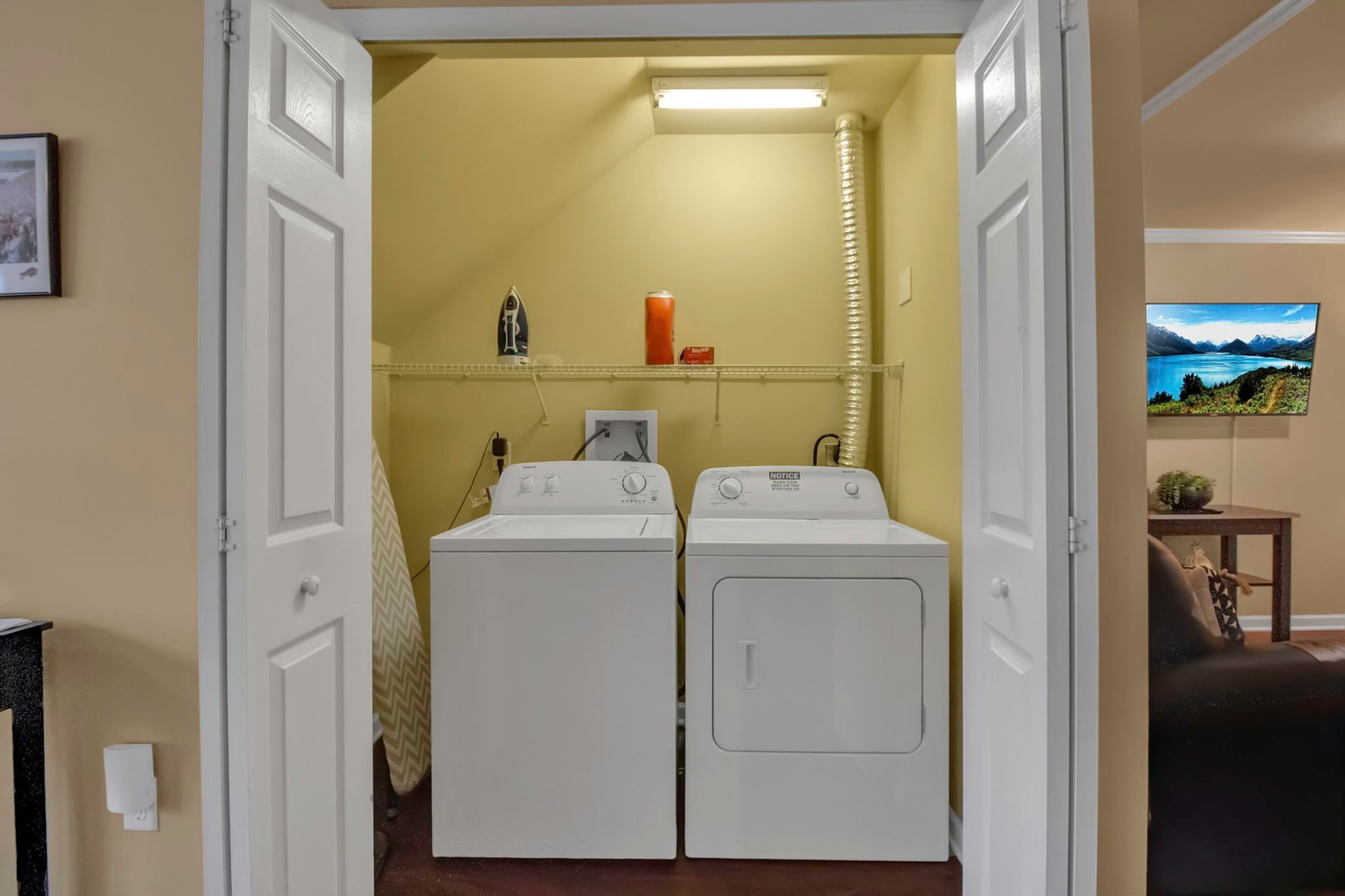 A laundry room with a washer and dryer in it.