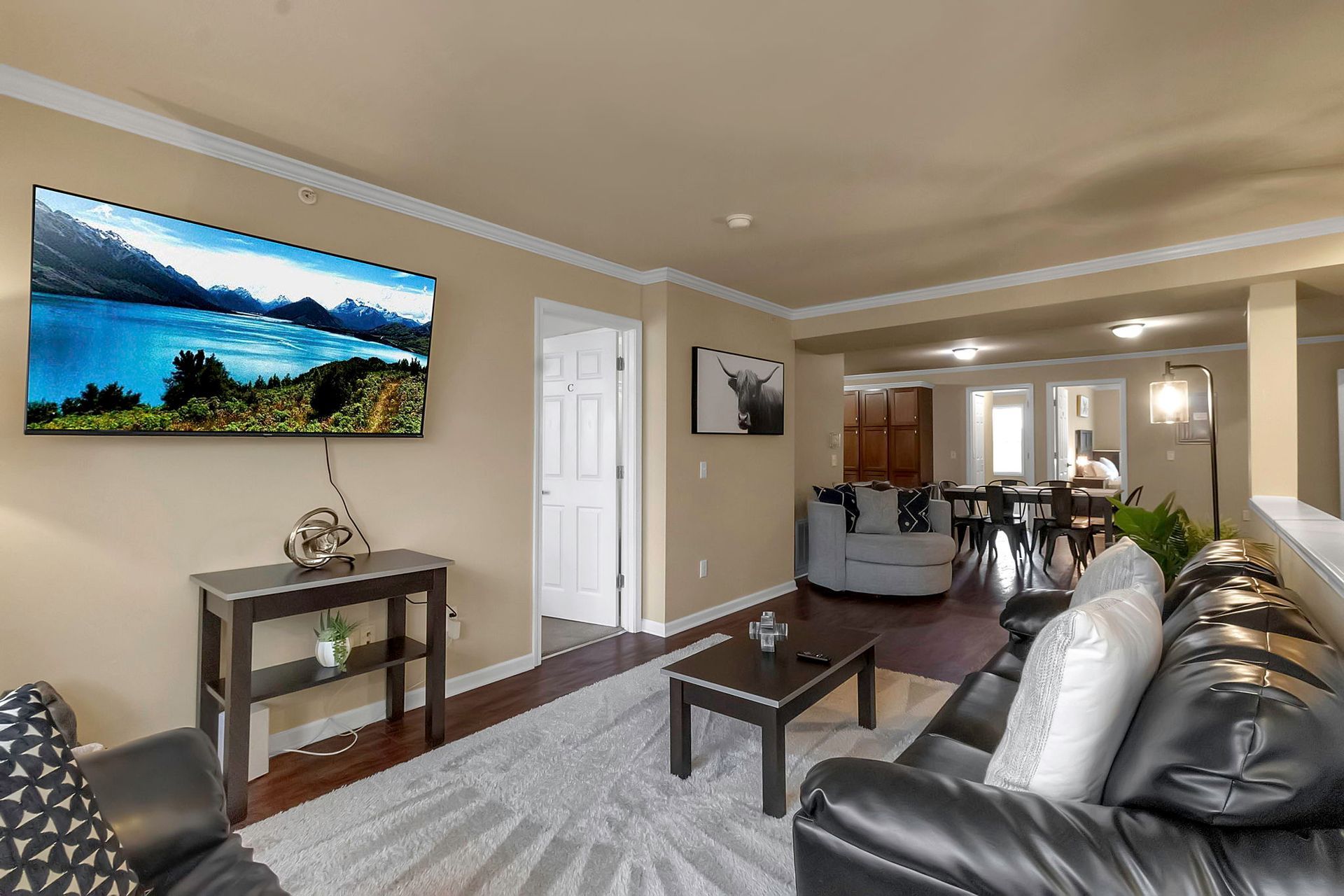 A living room with a couch , table , and television.