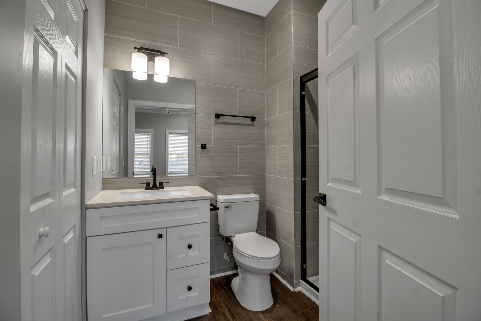 Bathroom space with tile wall finish and polished fixtures