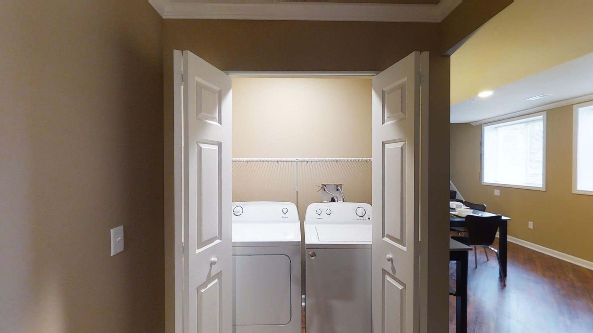 A laundry room with a washer and dryer in it.