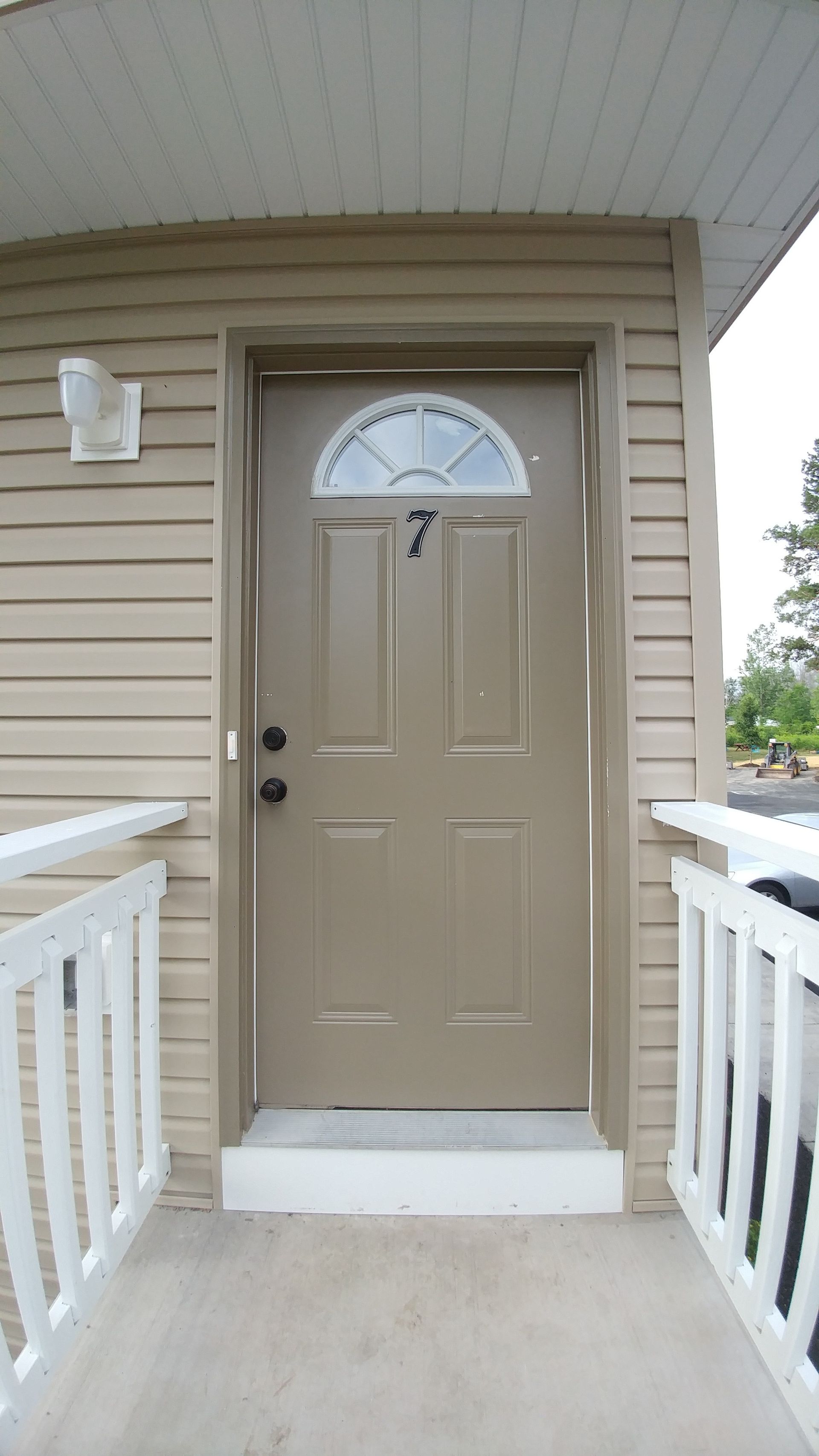 The number 7 is on the door of a house