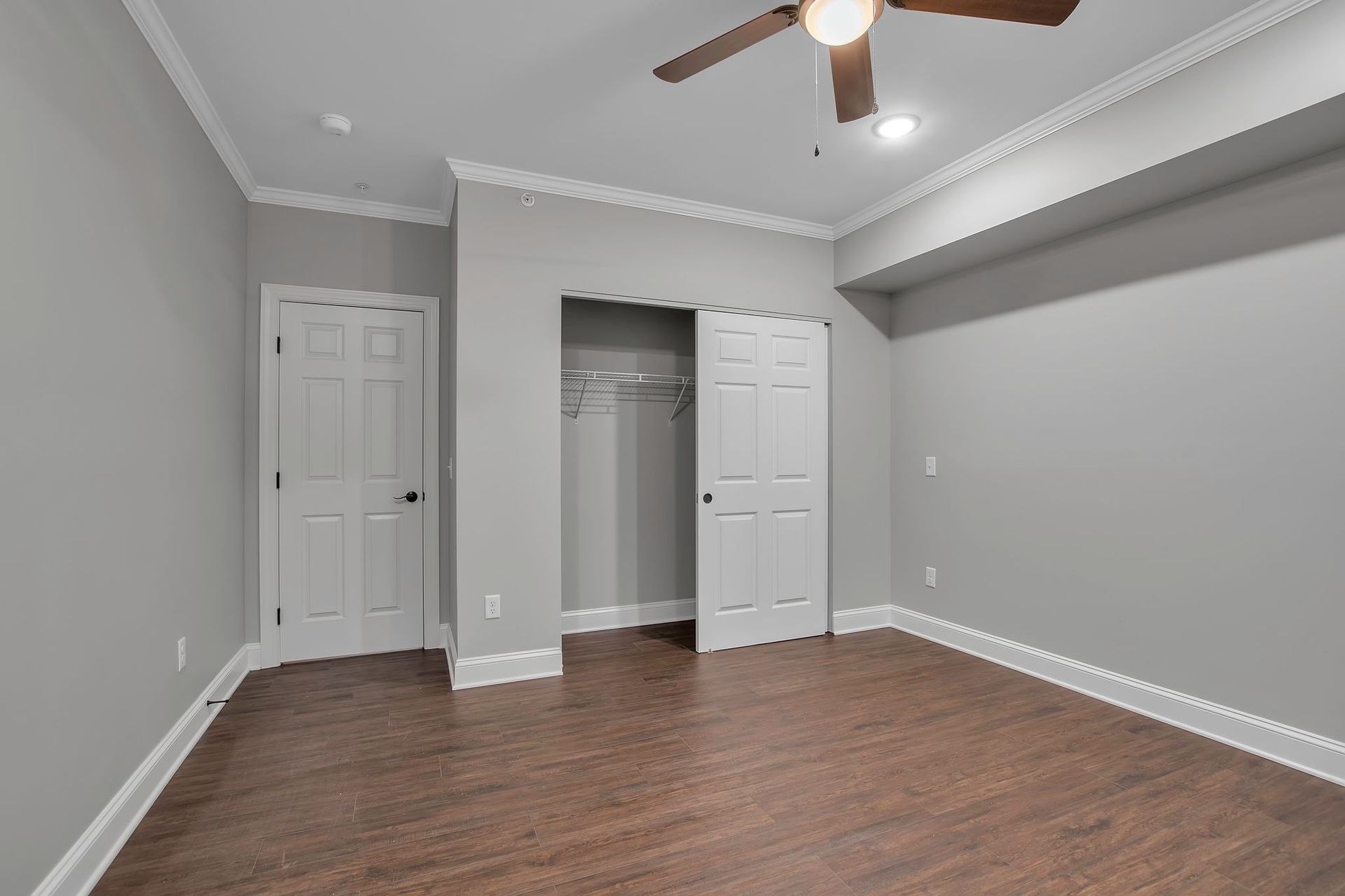 Spacious apartment closet with sliding door