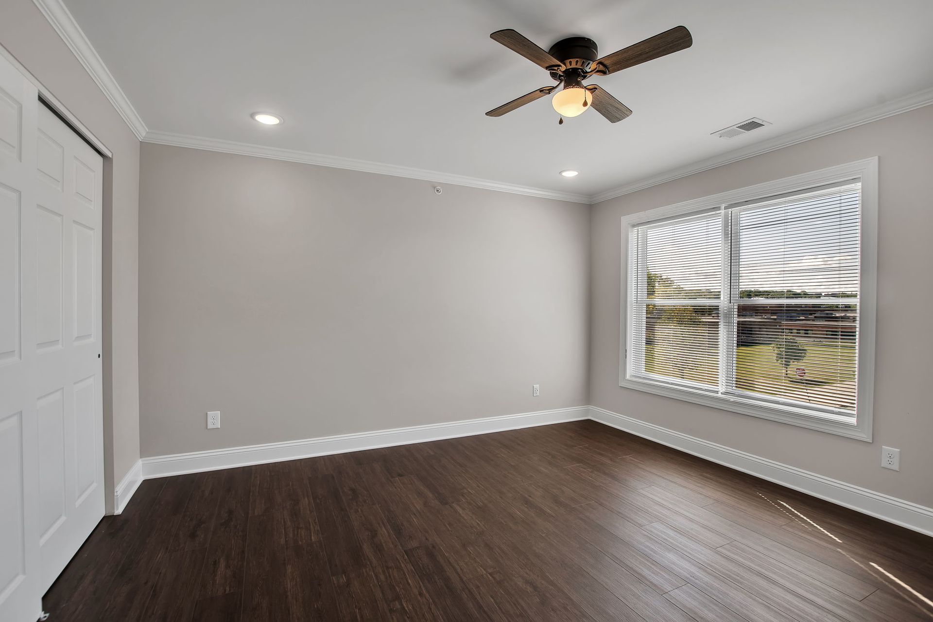 Large bedroom with closet space in apartment unit