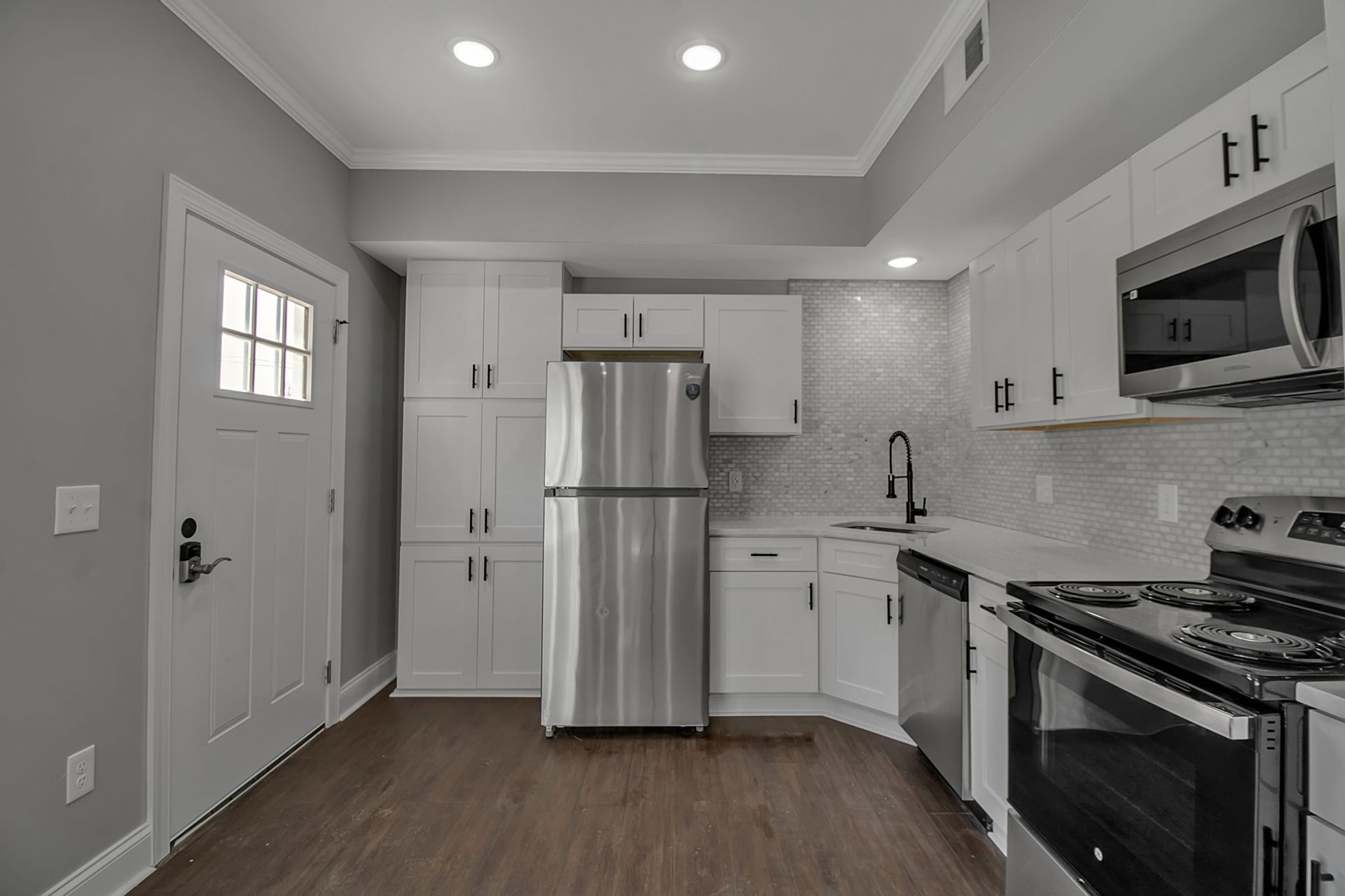 Cooking space with modern cabinet installation and clean surfaces