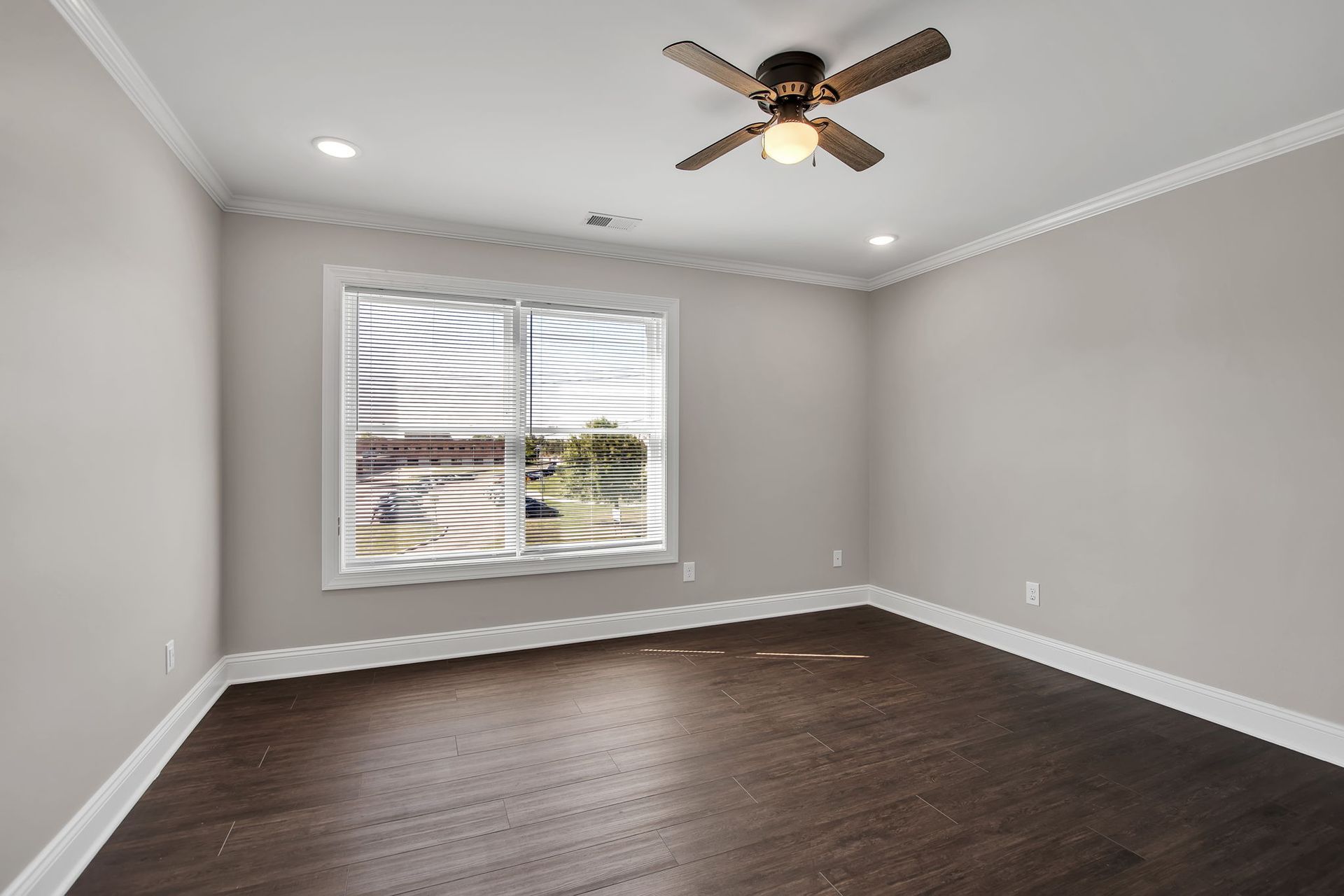 Sleeping area arranged with contemporary flooring and neutral palette