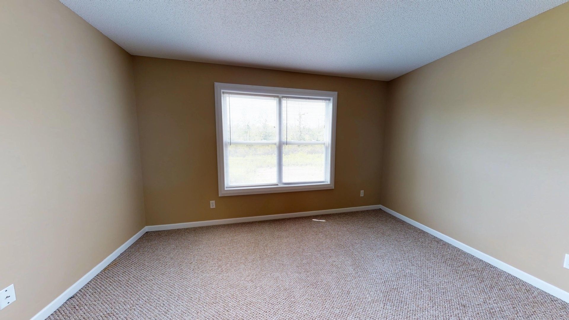 There is a large window in the middle of the room.