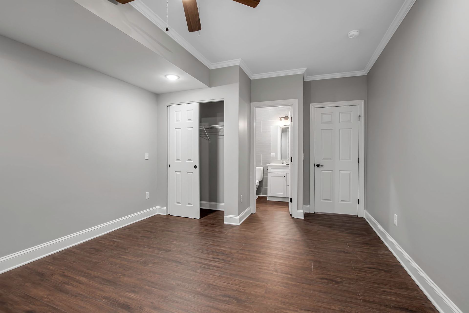 Interior sleeping space designed with neutral tones and trim