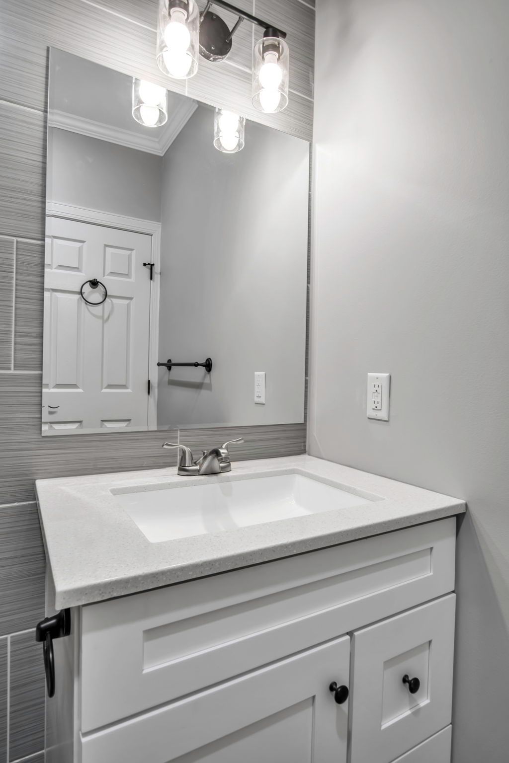 Bathroom area designed with contemporary tile layout