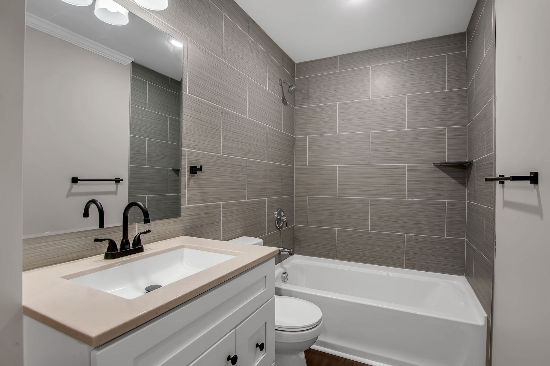 Bathroom interior with sleek tile finish and modern sink fixture