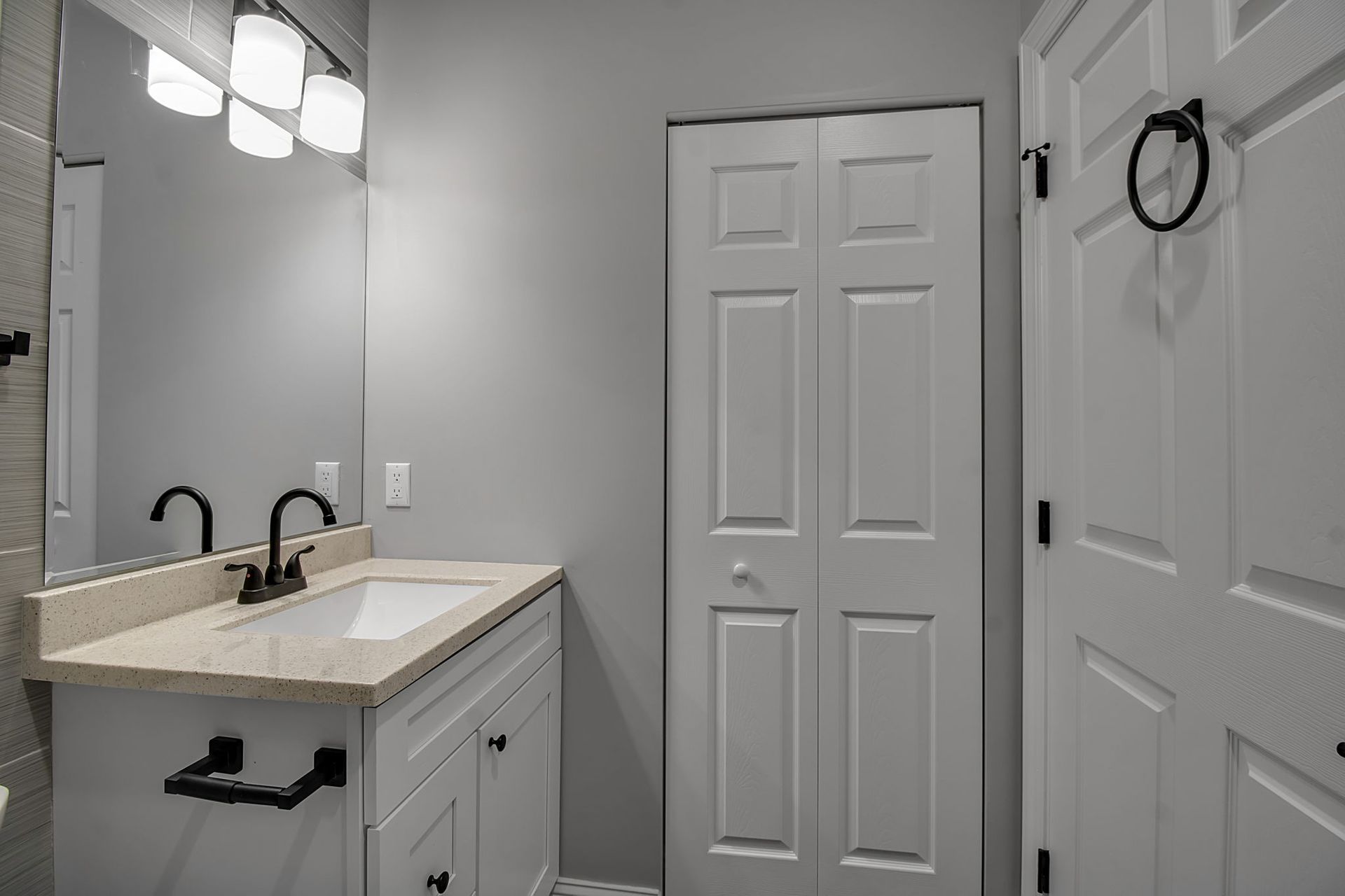 Washroom area with modern vanity design and sink fixture