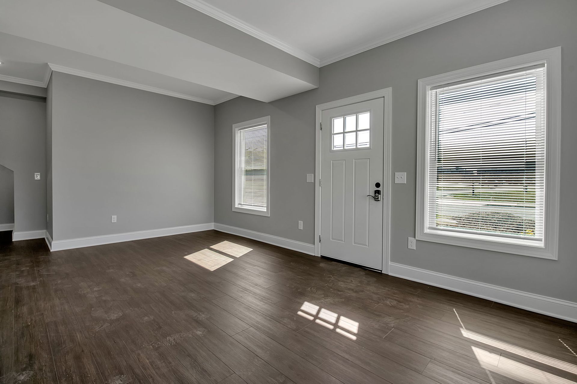 Open concept apartment living room with recessed lighting