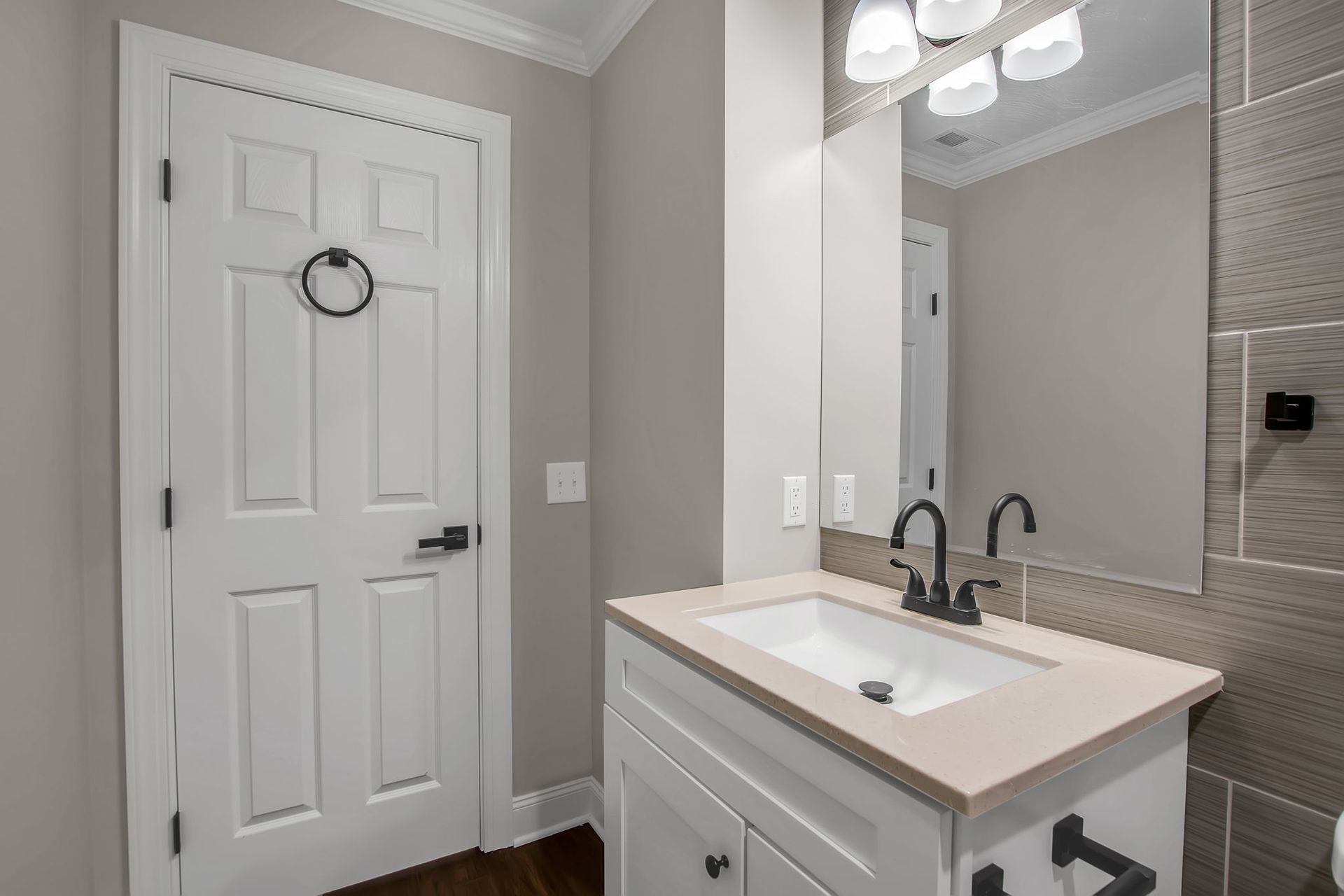 Washroom environment with sleek sink fixture and cabinet