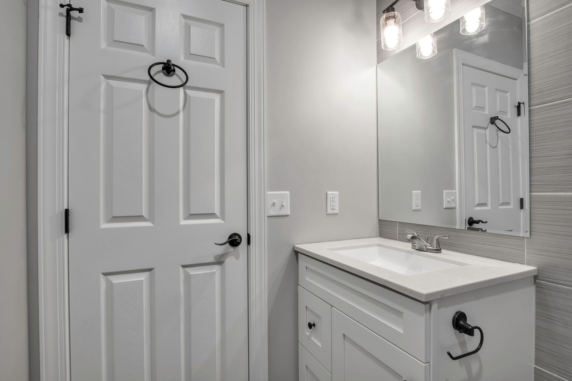 Bathroom interior showcasing tile finish and sink unit