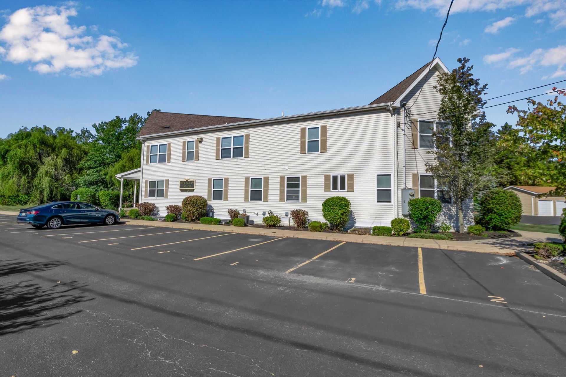 Parking spaces located beside apartment homes