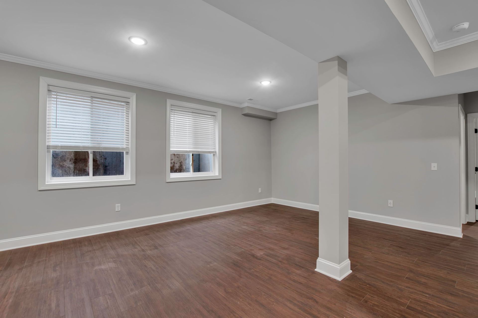 Sitting room area with contemporary flooring and open interior flow