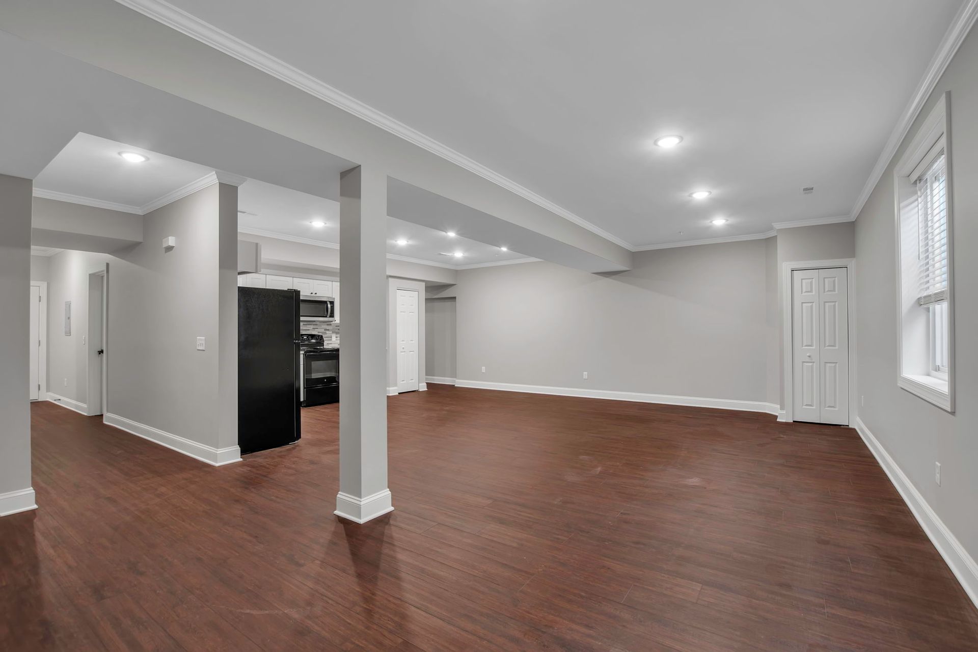 Lounge space featuring wide flooring pattern and neutral paint palette