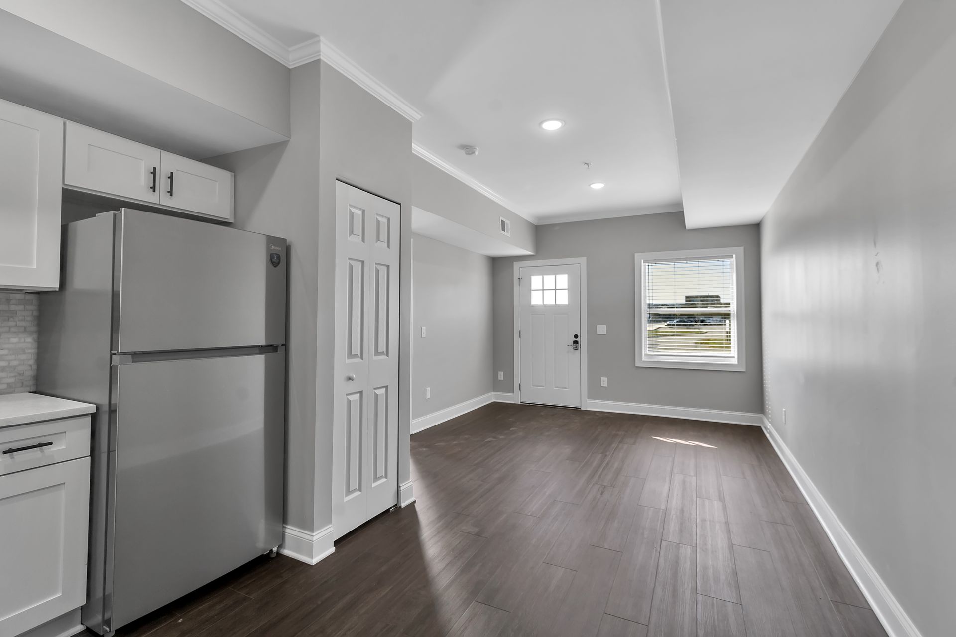 Living space with subtle ceiling lights and polished floor surface