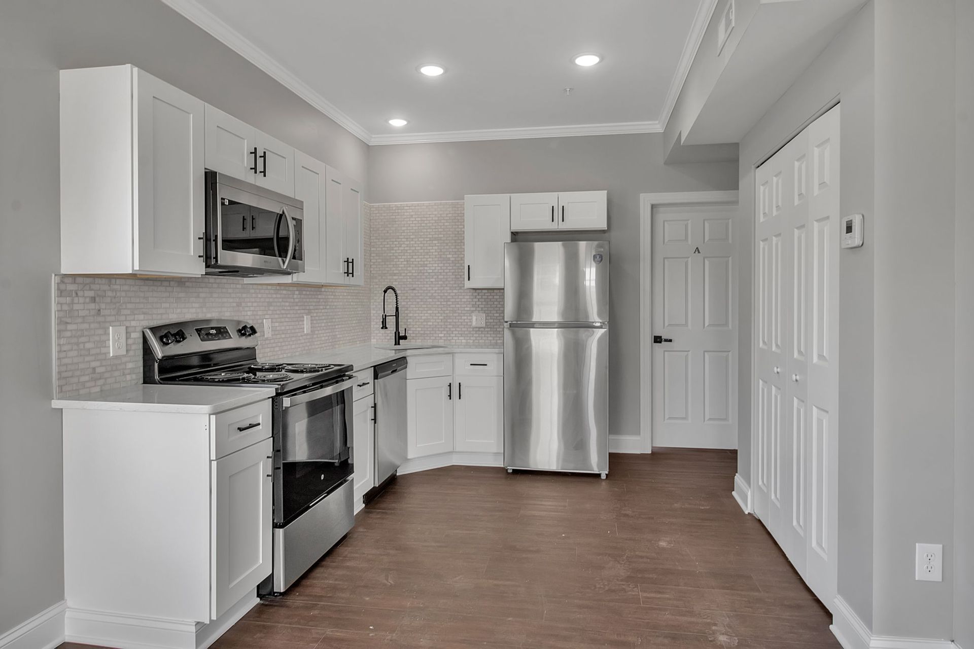 Contemporary apartment kitchen with modern cabinetry